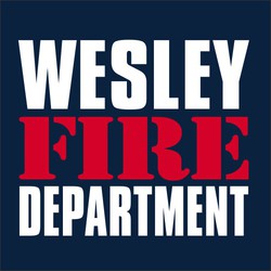 two color fire department tee shirt design with department name, the word FIRE below that in red, and the word DEPARTMENT below that. Normally printed on the back.