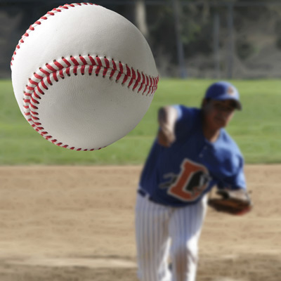 Baseball player pitching a baseball