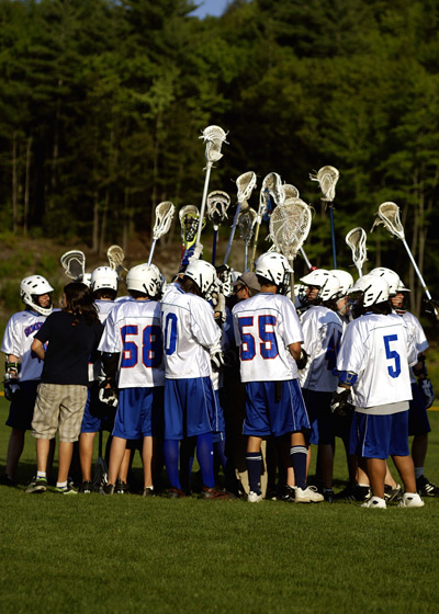 Lacrosse team in a huddle