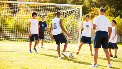 Boys playing soccer.