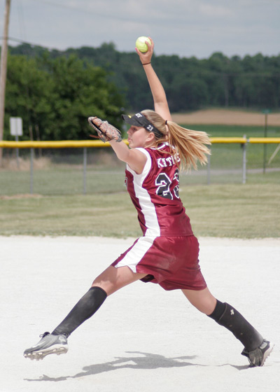 Softball player pitching