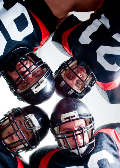 Football players in a huddle